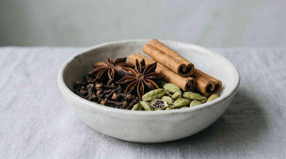bowl with cinnamon, cardamom and cloves